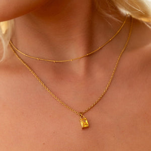 NIKITA citrine pendant necklace with a unique precious stone design and 18k plated gold finish. A water-resistant pendant and adjustable chain made with a hypoallergenic stainless steel base. Christmas everyday jewellery gift for her.