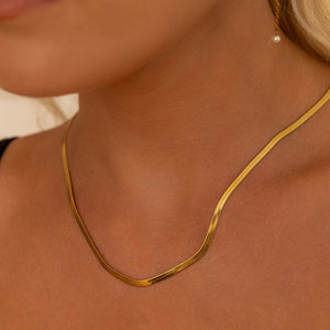 NIKITA flat snake chain necklace. A waterproof, 18k gold plated quality chain, with a hypoallergenic stainless steel base. Every day jewellery gift for her.