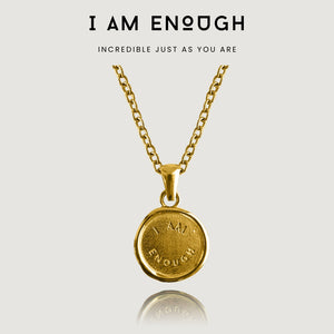 NIKITA 'I am Enough' engraved pendant necklace with a unique wax stamp inspired design and 18k plated gold finish. A water-resistant pendant and adjustable chain made with a hypoallergenic stainless steel base. Christmas everyday jewellery gift for her.