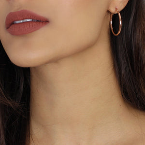 NIKITA classic, every day hoop earrings. Waterproof and hypoallergenic 18k plated hoops with a stainless steel base. Everyday jewellery gift for her.