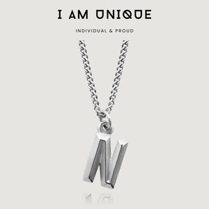 NIKITA custom initial pendant necklace with a unique, personalised letter design. A water-resistant silver pendant and adjustable chain made with a hypoallergenic stainless steel base. Christmas everyday jewellery gift for her.