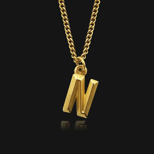 NIKITA custom initial pendant necklace with a unique, personalised letter design. A water-resistant 18k gold plated pendant and adjustable chain made with a hypoallergenic stainless steel base. Christmas everyday jewellery gift for her.