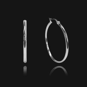 NIKITA classic, every day hoop earrings. Waterproof and hypoallergenic 18k plated hoops with a stainless steel base. Everyday jewellery gift for her.