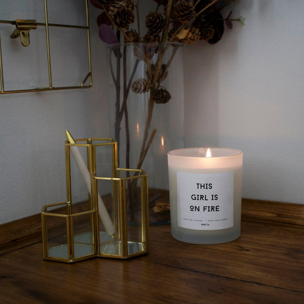 NIKITA Empowering white frosted glass candle, labelled 'Ignite your inner power'. Featuring a white jasmine scent. Christmas or birthday home decor gift for her.