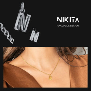 NIKITA custom initial pendant necklace with a unique, personalised letter design. A water-resistant silver pendant and adjustable chain made with a hypoallergenic stainless steel base. Christmas everyday jewellery gift for her.